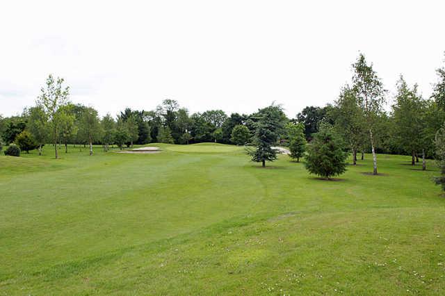 A view of the 17th hole flanked by sand traps at Castlewarden Golf Club