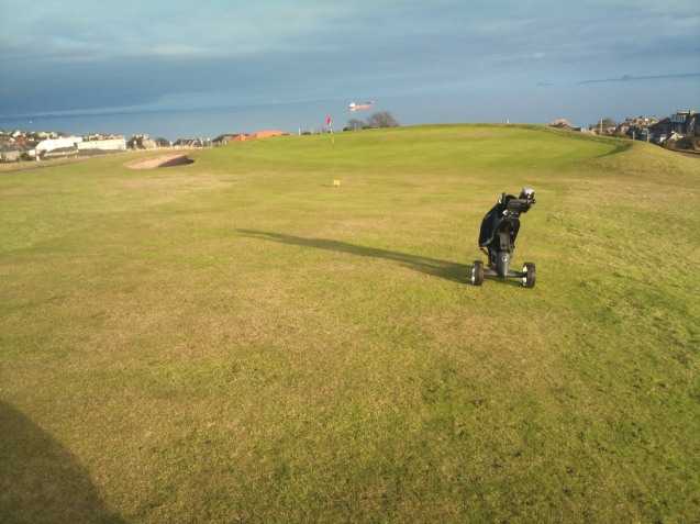 A view of a hole with sand trap on the left side at Scoonie Golf Club