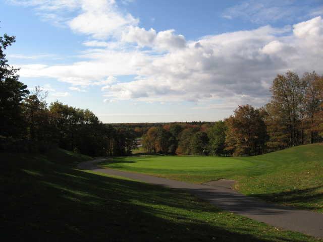 View of the 17th green with narrow path on the left at Cedar Creek Golf Course