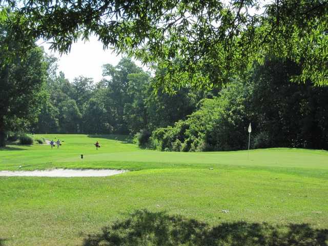 A view of green with bunker on the left side at Herndon Centennial Golf Course