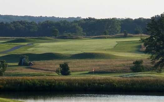 A view over the water of a hole and a fairway at Redfield Golf & Country Club