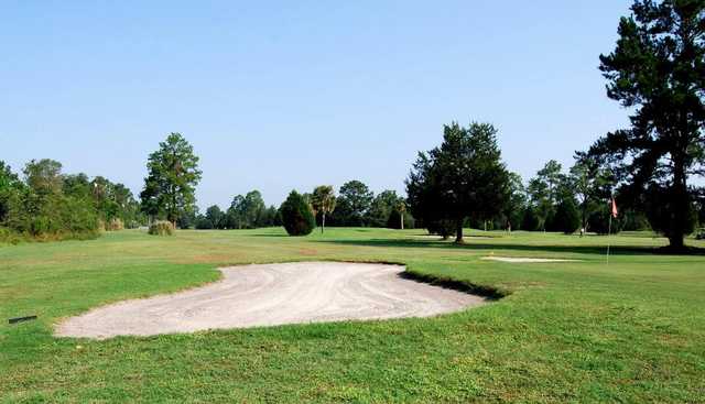 A view of a hole guarded by bunker at Folkston Golf Club