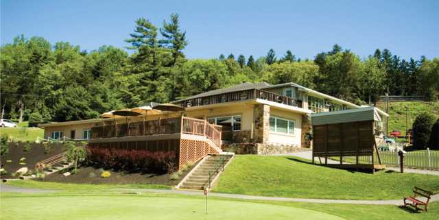 A view of the clubhouse and putting green at Galen Hall Golf Club