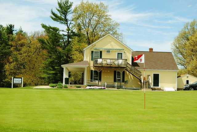 A view of the 2nd green with clubhouse in background at Twin Springs Golf Course