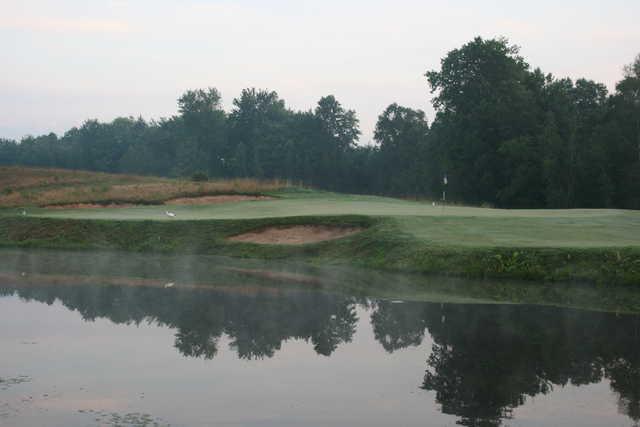 A view over the water of the 14th green at Rome Country Club