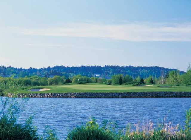 A view over the water of a green at Eagle's Talon Course from Willows Run Golf Club