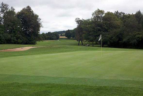 A view of green #7 protected by a bunker at Dutch Hollow Country Club