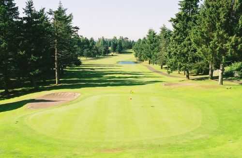 A sunny view of green #9 at North Shore Golf Club