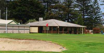 A view of green guarded by bunker at North Haven Golf Club