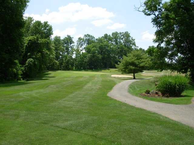 A view of green #8 with narrow path on the right at Sunset Golf Course