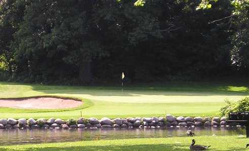 A view over the water of green #4 at Eastern Hills Golf Club