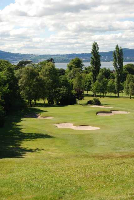 A view of the 4th hole surrounded by a collection of bunkers at Holywood Golf Club