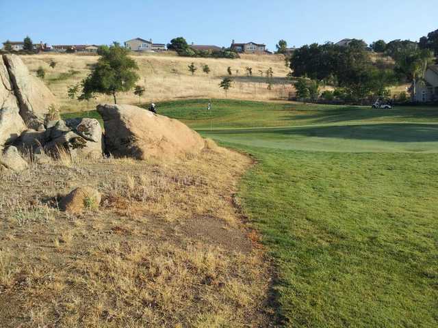 Large rocks guard the par-3 fourth at Whitney Oaks Golf Club