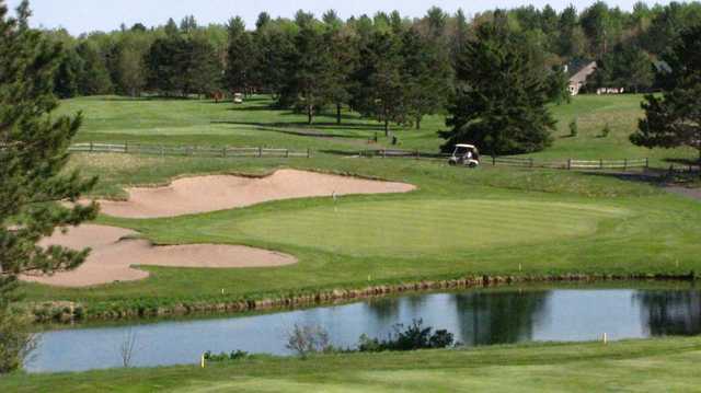 A view of a green protected by bunkers at Timber Ridge Golf Club.