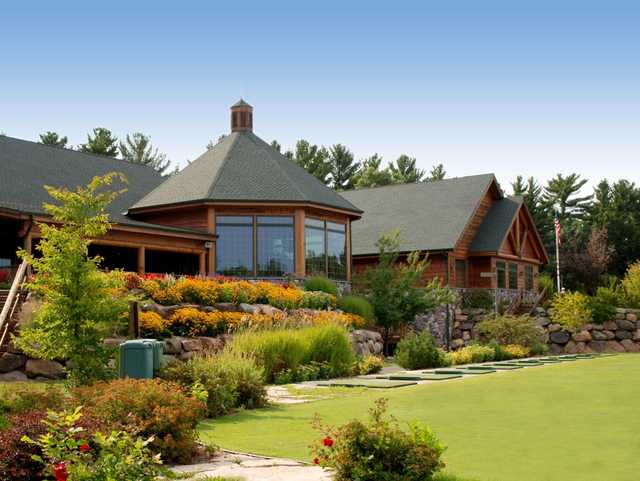 A view of the clubhouse and practice area at Wild Rock Golf Club
