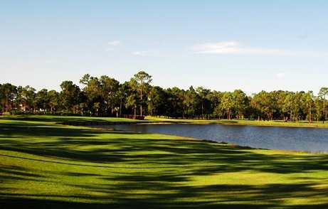 A view of a fairway with water on the right at Foxfire Country Club