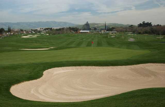 A view of green protected by bunkers at Los Lagos Golf Course