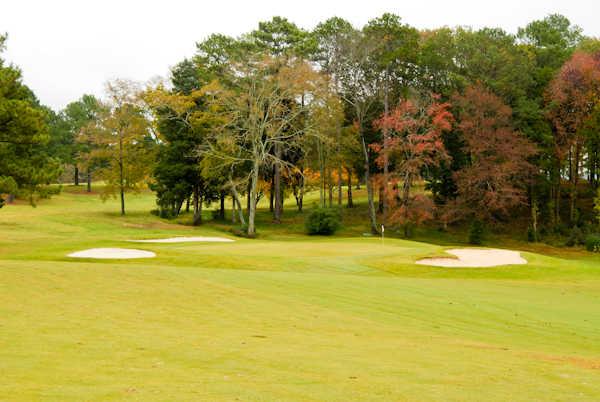 A view of a green protected by bunkers at Lake Course from Goose Pond Colony Resort
