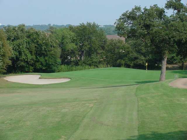 A view of a hole guarded by sand traps at Texas Rangers Golf Club.