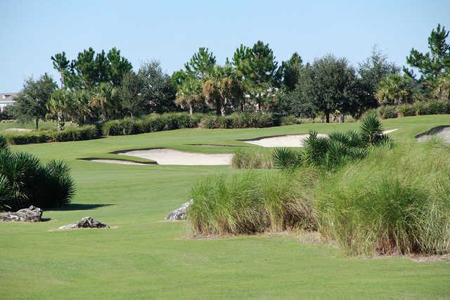 A view of a green protected by bunkers at Candler Hills Golf Club