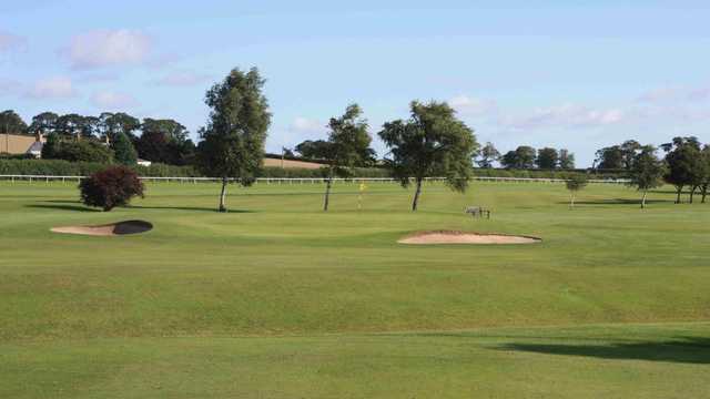 A view of a hole guarded by sand traps at Kelso Golf Club