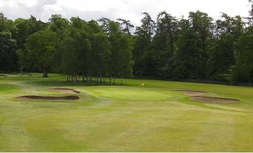 A view of the 12th green protected by bunkers at Newbattle Golf Club