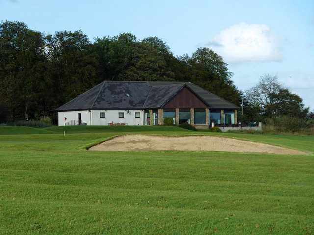 18th at Langlands Golf Club with clubhouse in background