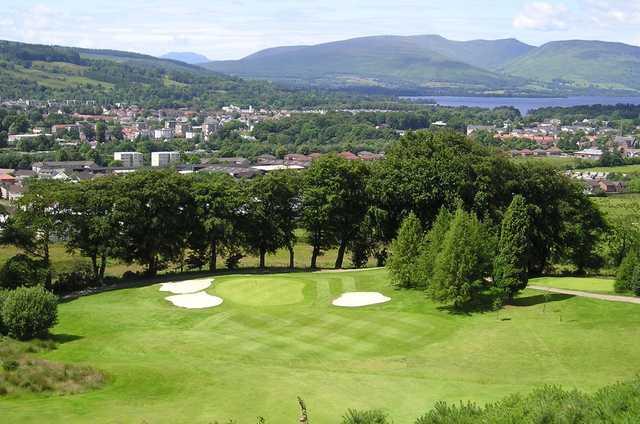 A view of a green protected by bunkers at Vale of Leven Golf Club