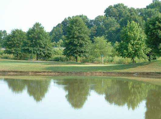 A view over the water of a green at Twin Bridges Golf Club