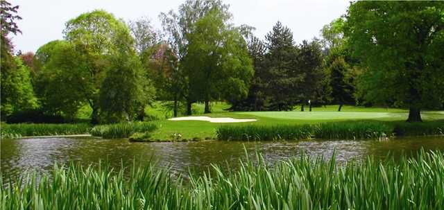 Eastmoreland #12: Hole #12 is mostly water from tee to green. A deep bunker guards the left-front of the green and trees line the back and right. The green pitches sharply to the front-right.