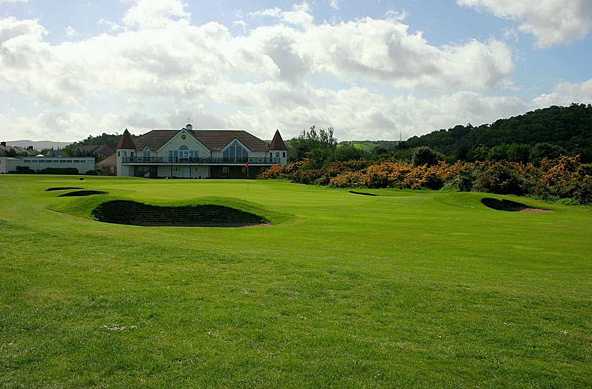 A view of the 19th green with clubhouse in background at Conwy Golf Club