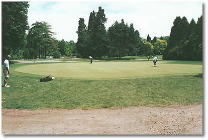 The putting green is through a golfer tunnel that runs under Bybee Blvd. It is very large and chipping is allowed.