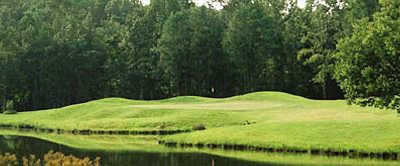 A view over the water of green at Windy Hill Golf Course