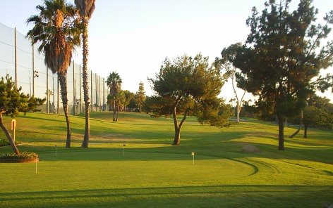 A view of the putting green and 1st tee at Newport Beach Golf Course