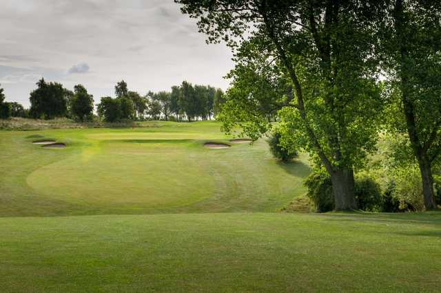 View of an approach shot to a well-protected green at Bedford & County Golf Club