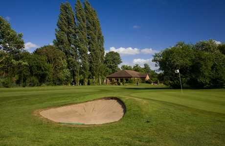 A view of  a hole guarded by bunker at Datchet Golf Club