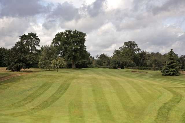A view of the 13th green and fairway at Newbury & Crookham Golf Club