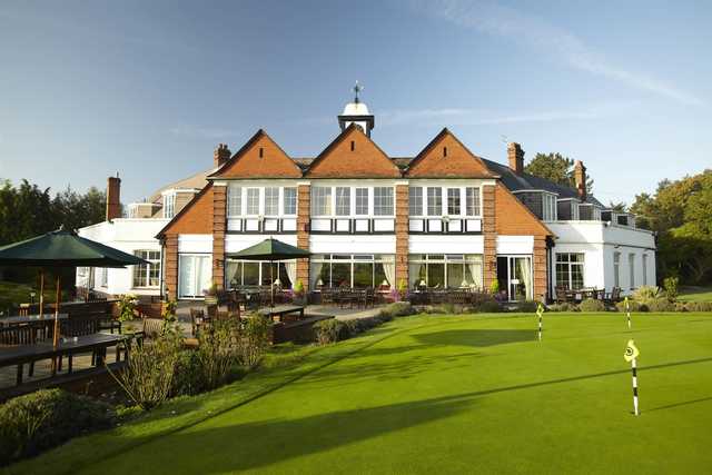 A view of the clubhouse and putting green at Burnham Beeches Golf Club