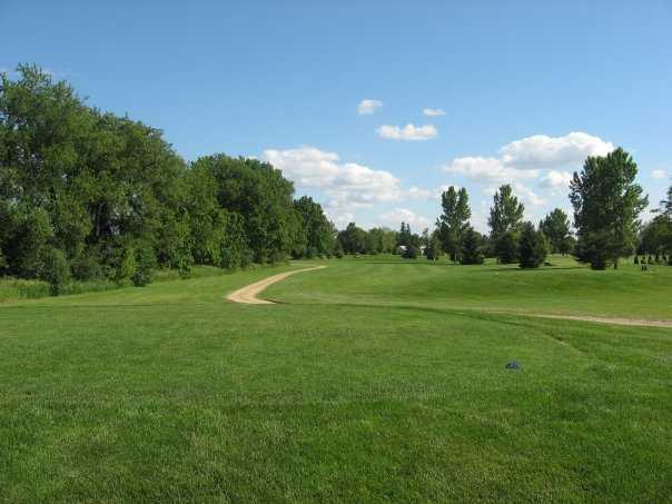 A view from a tee with a narrow path in background at Blue from Coachman's Golf Resort.