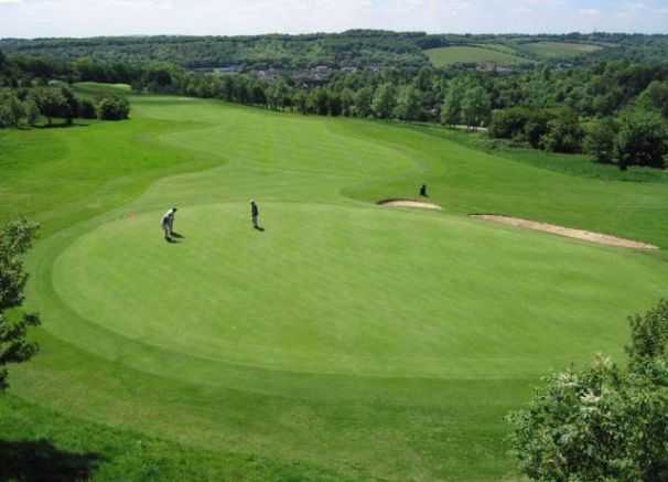 A view of a hole and fairway at Wycombe Heights Golf Centre