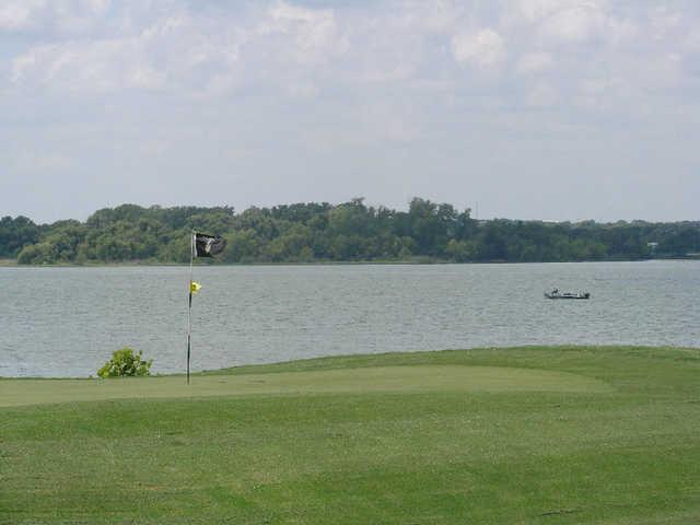 A view of the 3rd green with water in background at Cleburne Golf Links.