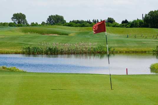 A view of the 4th green with water in background at Burstwick Country Golf
