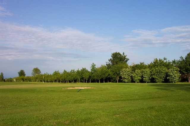 A view of green guarded by bunker at Cherry Burton Golf Club