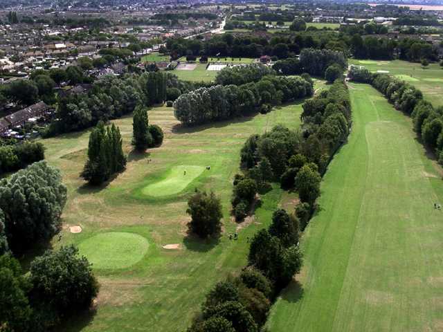 Aerial view above the 14th tee looking back down the 13th fairway with green #11 and #9 on the left side at Springhead Park Golf Club