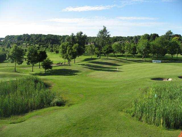 A view of a hole protected by bunkers at Forest Hills Golf Club
