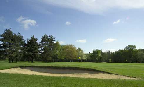 A view of green protected by sand trap at Bramshaw Golf Club