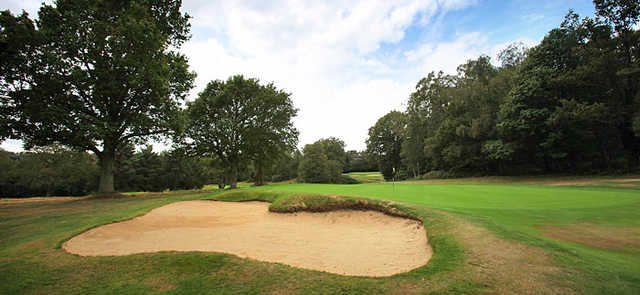 A view of hole #7 guarded by bunker at Stoneham Golf Club