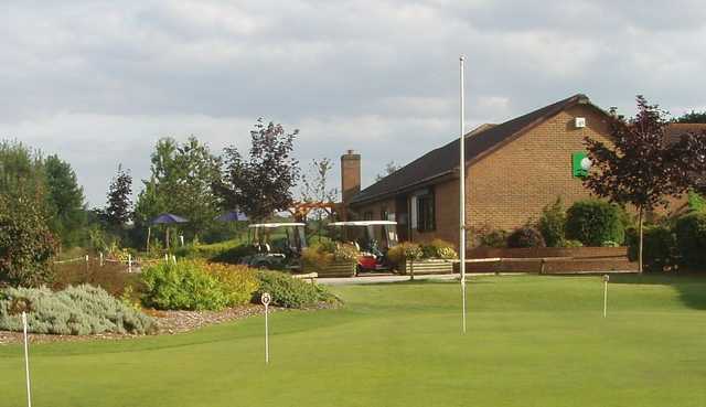 A view of the clubhouse and putting green at Test Valley Golf Club