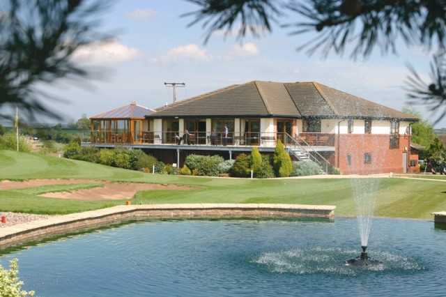 A view of the clubhouse with water fountain in foreground at Sapey Golf Club