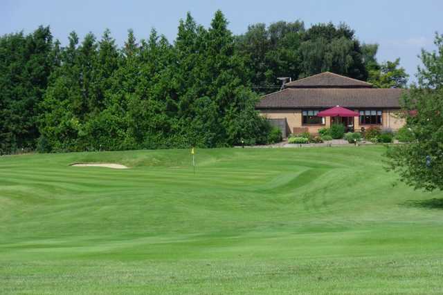 A view of a hole with clubhouse in background at Ver Course from Redbourn Golf Club